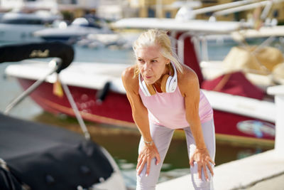 Portrait of young woman exercising in gym