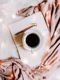 High angle view of coffee cup on table