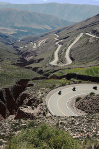 High angle view of road amidst mountains
