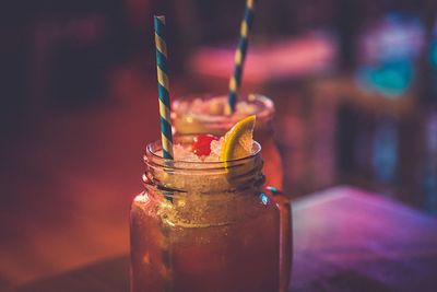 Close-up of drink in glass jar on table