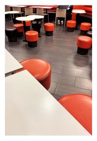 High angle view of chairs and tables in restaurant