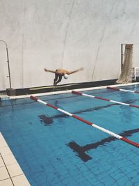 Man diving in pool