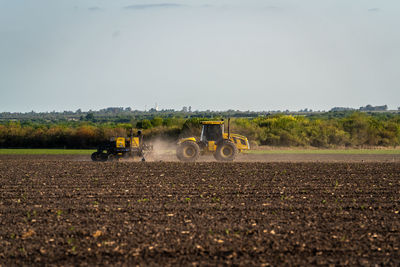 Tractor plowing the land for sowing