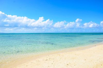 Scenic view of sea against blue sky