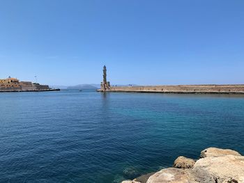 Scenic view of sea against clear blue sky