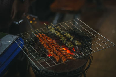 High angle view of meat on barbecue grill