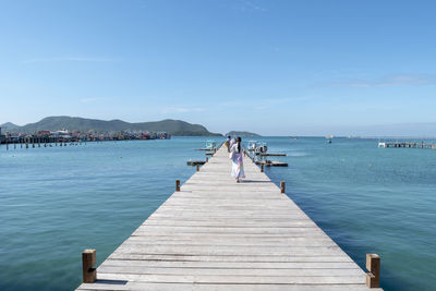 Pier over sea against sky