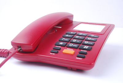 High angle view of telephone booth against white background