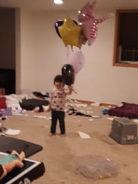 Children playing with toy at home