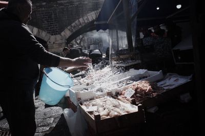 Man working at market stall