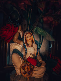 Young woman sitting in a dress