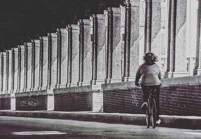 Full length of woman standing by railing