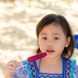 Close-up of girl eating food