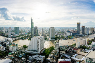 High angle view of modern buildings in city against sky