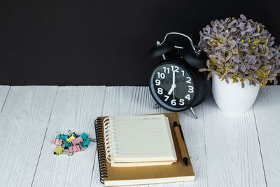 High angle view of clock on table
