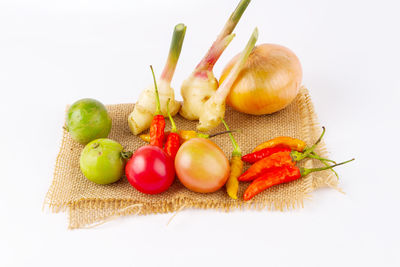 Close-up of fruits against white background