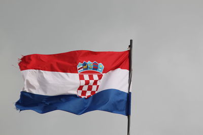 Low angle view of croatian flag against clear sky