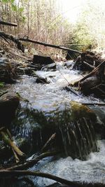 Scenic view of river flowing through rocks