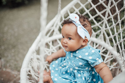 Portrait of cute baby girl looking away