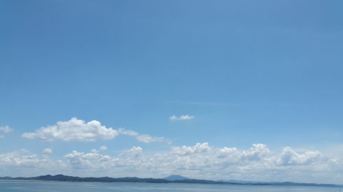 Scenic view of sea against blue sky