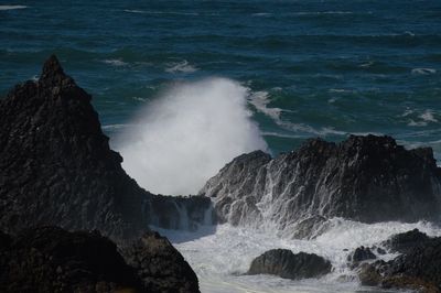 Waves splashing on rocks at shore