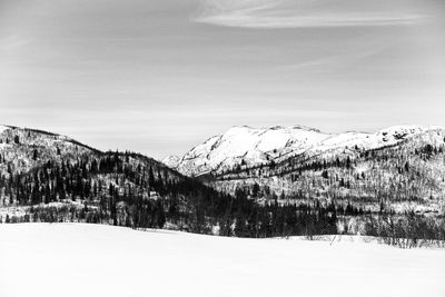 Scenic view of snow covered mountains