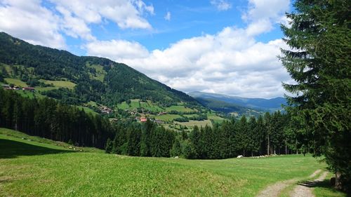 Scenic view of mountains against cloudy sky