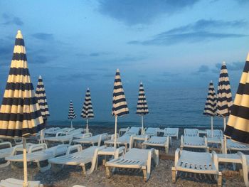 Panoramic view of lounge chairs on beach