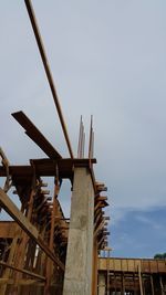 Low angle view of windmill against sky