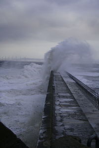 Pier over sea against sky