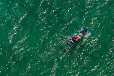 High angle view of people on boat in sea