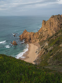 Landscape view of charming blue ocean coastline green grass hills sandbanks  inspiring  natural park