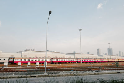 Train on bridge against sky