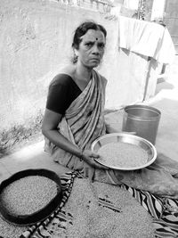 Portrait of woman sitting outdoors