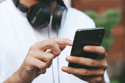 Close-up of man using mobile phone