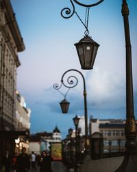 Street lights in city at dusk