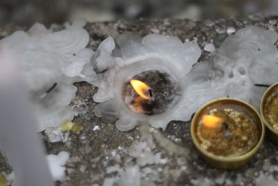 High angle view of burning candles