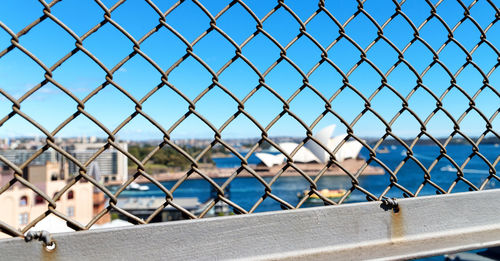 Chainlink fence against blue sky