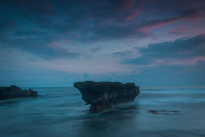 Scenic view of sea against sky at sunset