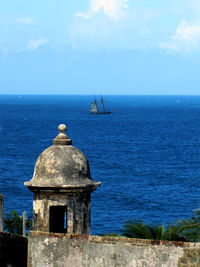 Sailboat on sea against sky