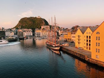 Cityscape of alesund in norway at sunset, aerial view over the harbor 