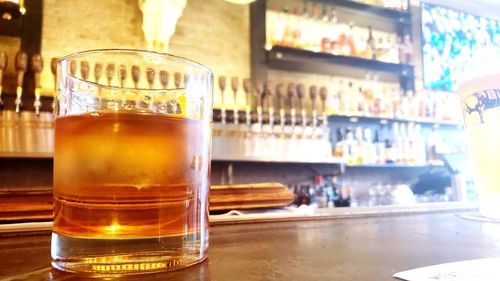 Close-up of beer glass on table