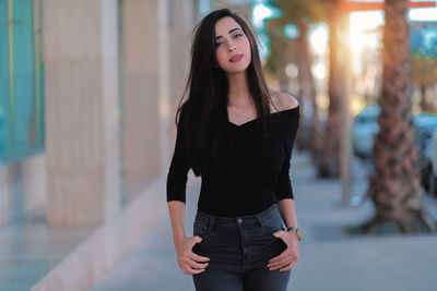 Portrait of beautiful woman standing outdoors