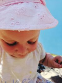 Close-up of baby girl wearing hat