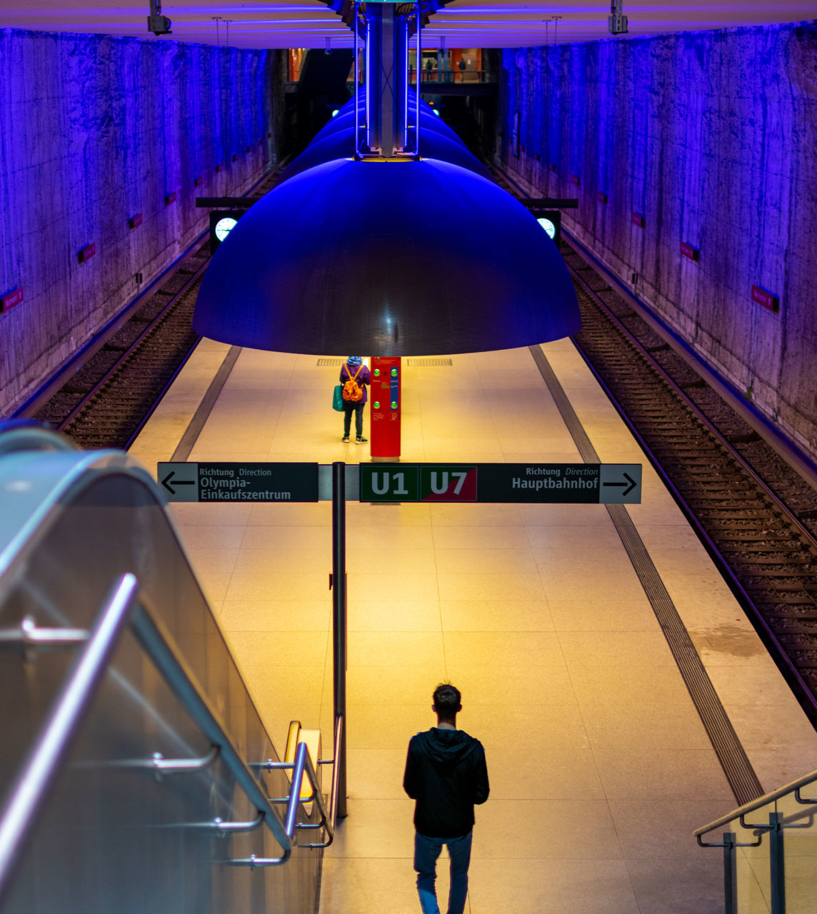 Illuminated Men Real People Lifestyles Lighting Equipment Architecture Indoors  Built Structure Leisure Activity Rear View One Person Staircase High Angle View Railing Transportation Steps And Staircases The Way Forward Walking Modern Subway Station