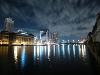 Illuminated city at waterfront