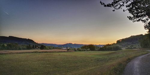 Scenic view of landscape against sky during sunset