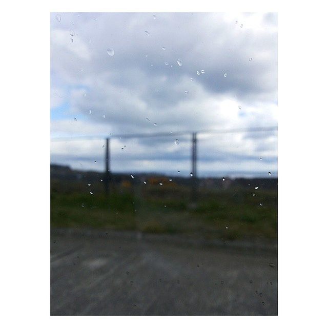 transfer print, transparent, sky, window, wet, water, rain, auto post production filter, glass - material, drop, weather, indoors, cloud - sky, raindrop, nature, glass, transportation, no people, looking through window, cloudy