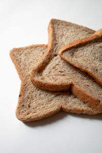 Close-up of bread on white background