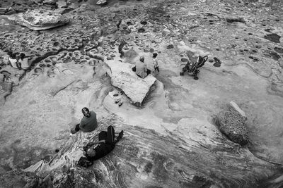 High angle view of people on rock formations